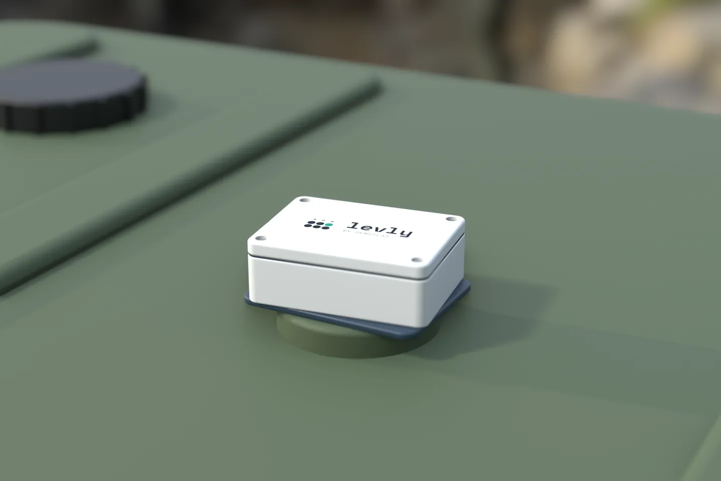 The Levly sensor on top of a green plastic oil tank